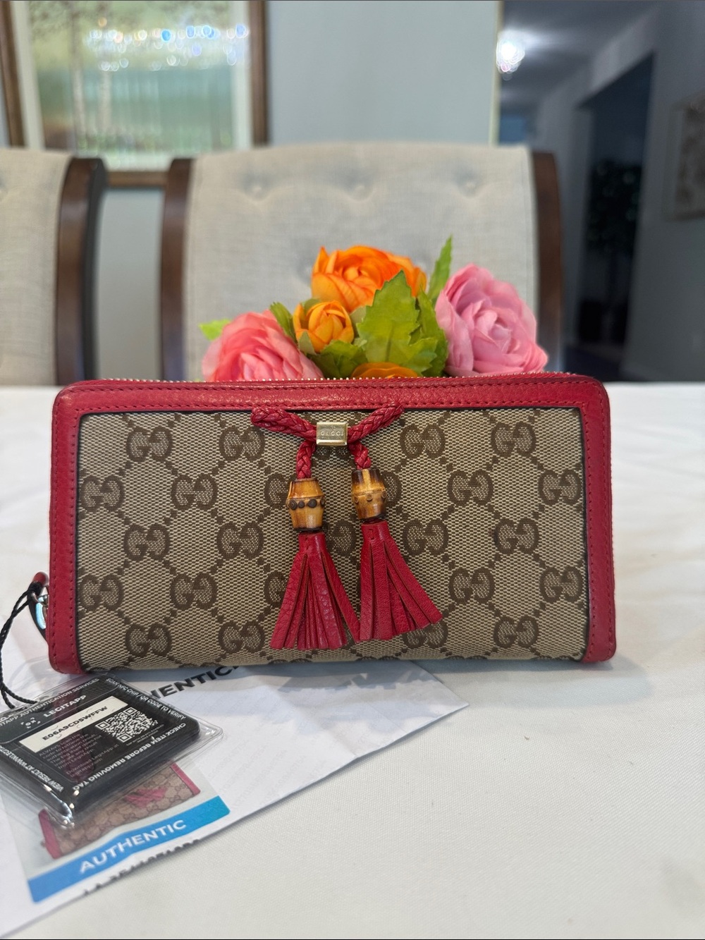 Authentic Gucci Beige GG Canvas Wallet with Red Tassel Trim